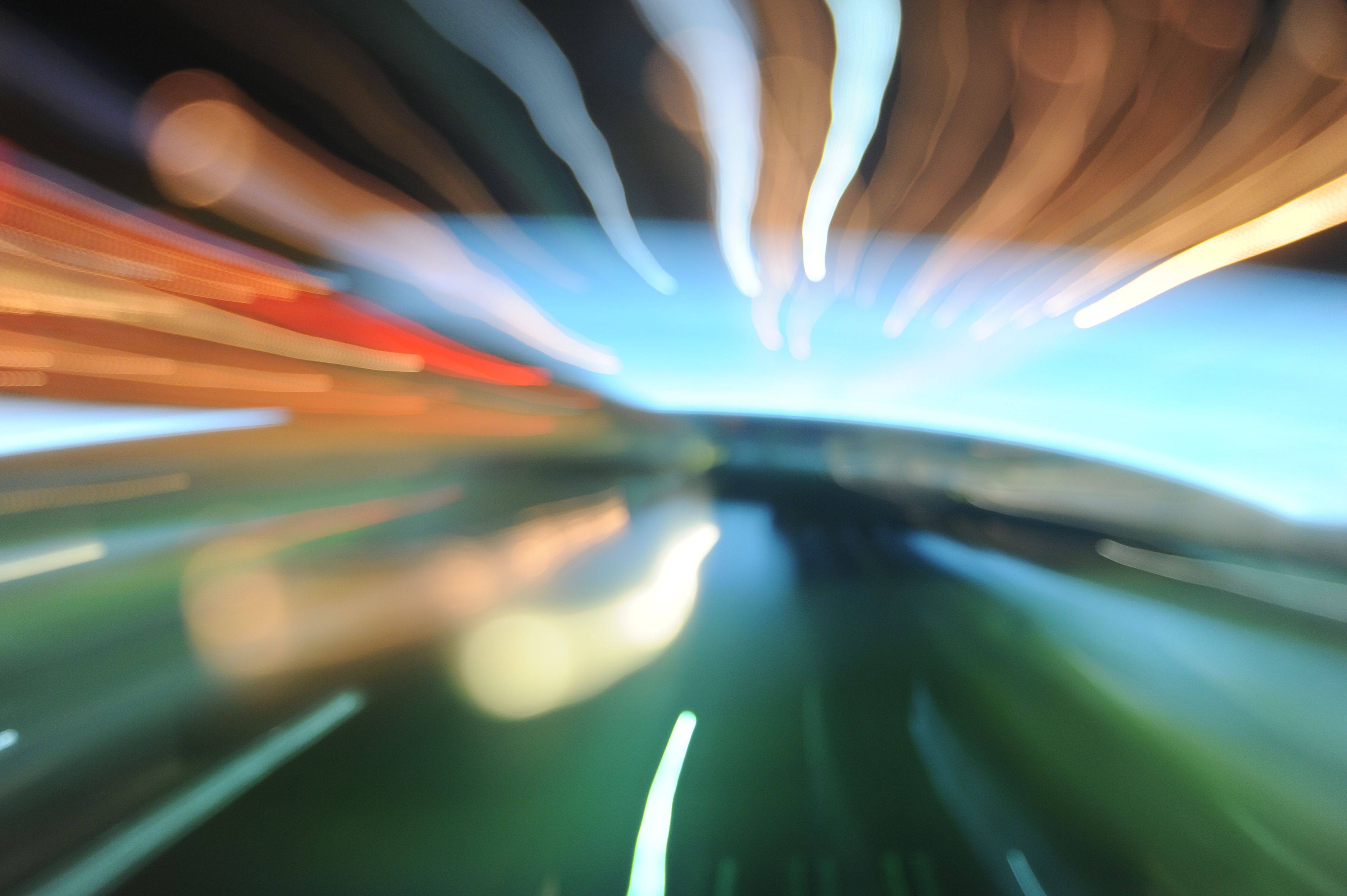 A long exposure at night, with streaks of light converging on the right edge.